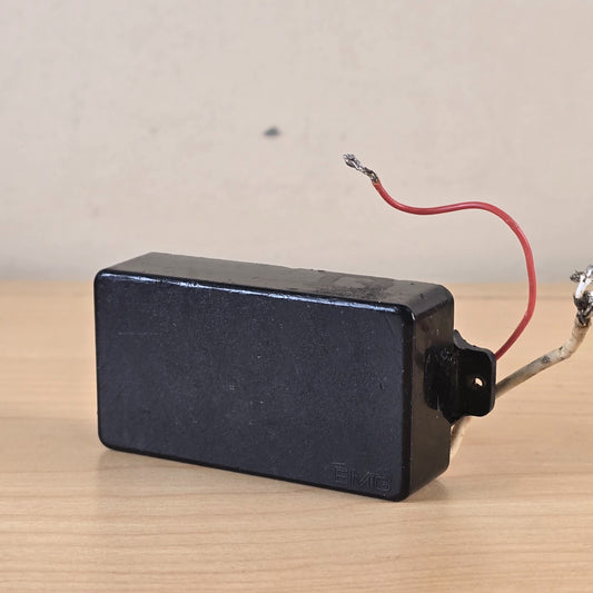Front angle view of EMG 81 pickup in black with leads