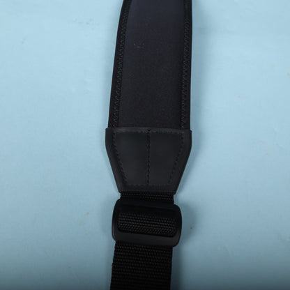 Detail of the molded plastic transition piece and adjustment slider on the strap.