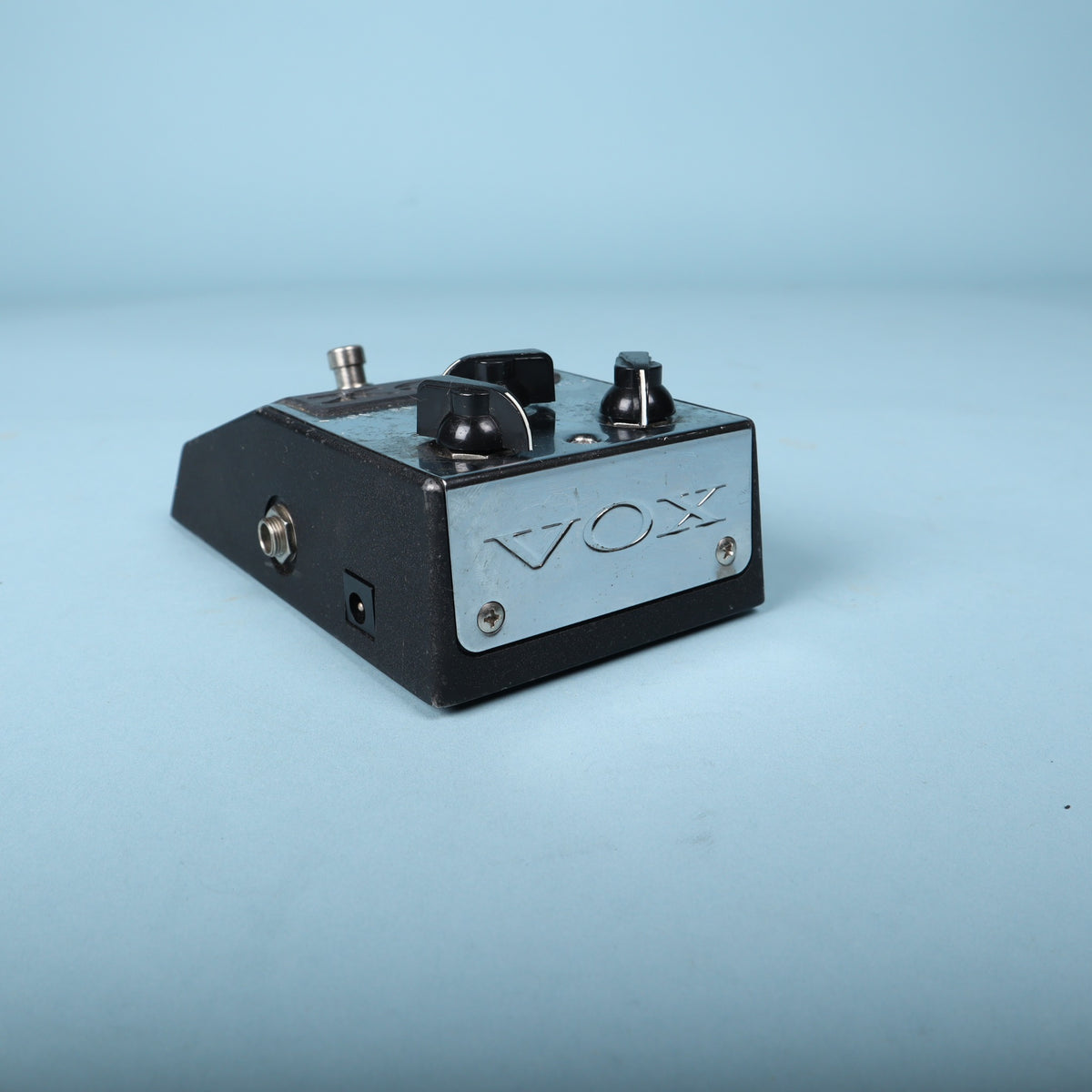 Rear view showing chrome Vox backplate and 9V DC power input jack