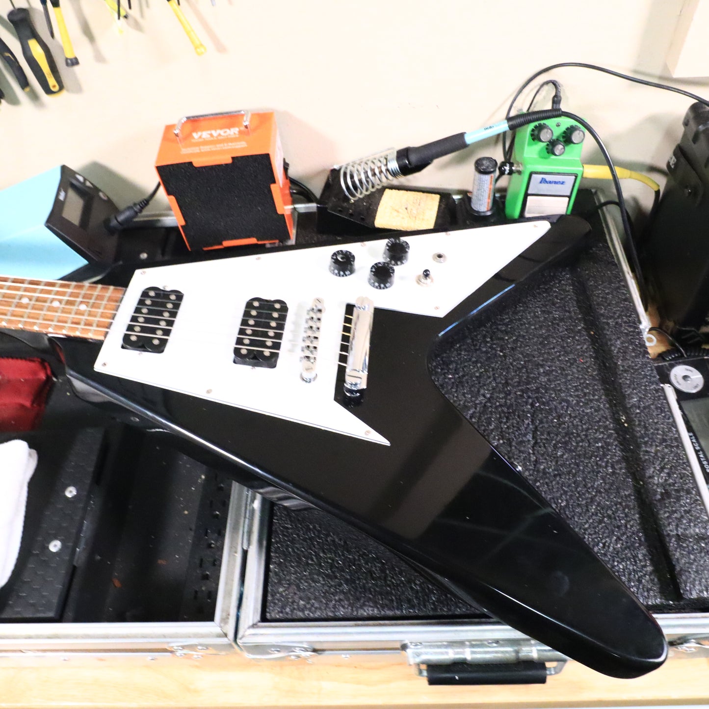 Flying V Style Electric Guitar in Black with White Pickguard