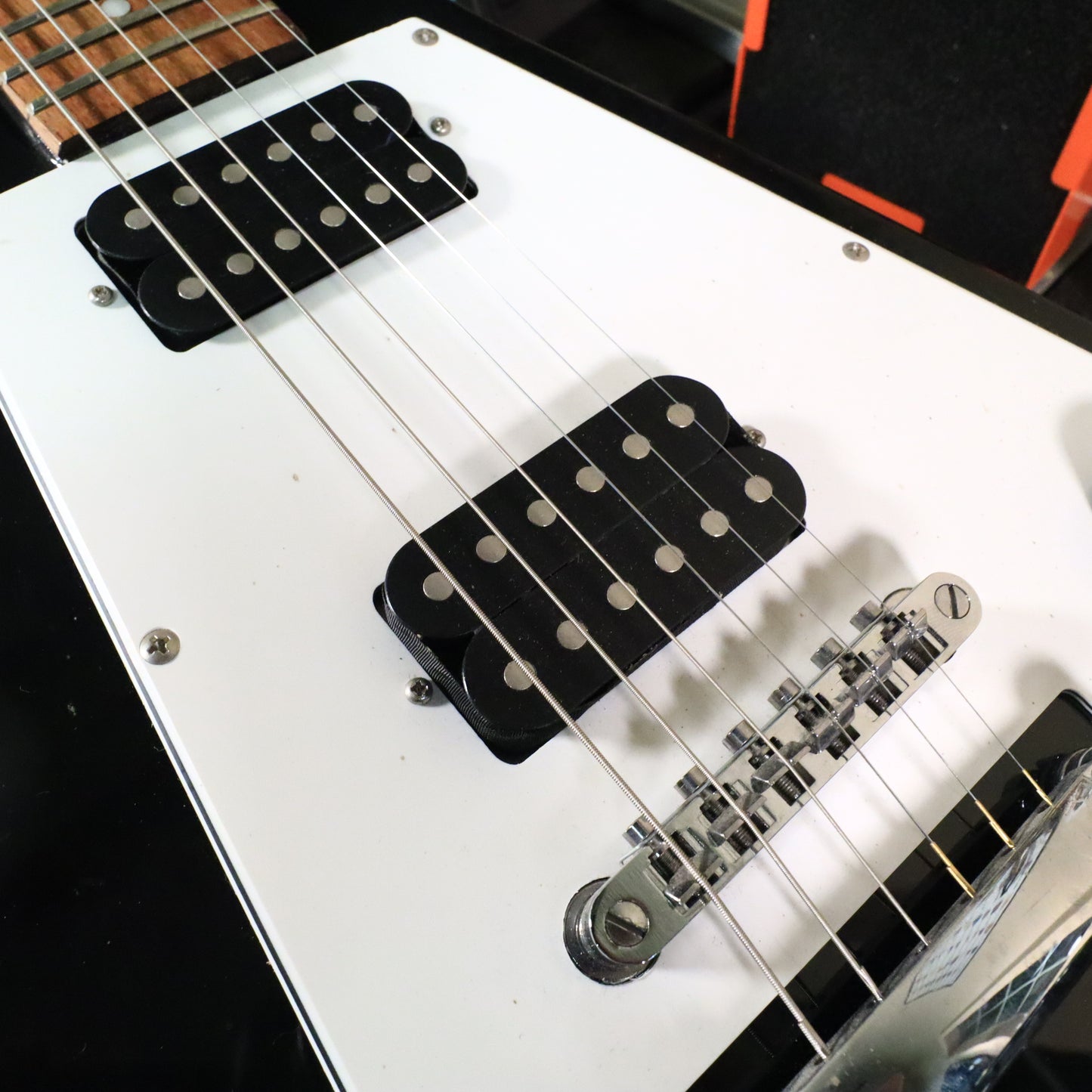 Flying V Style Electric Guitar in Black with White Pickguard