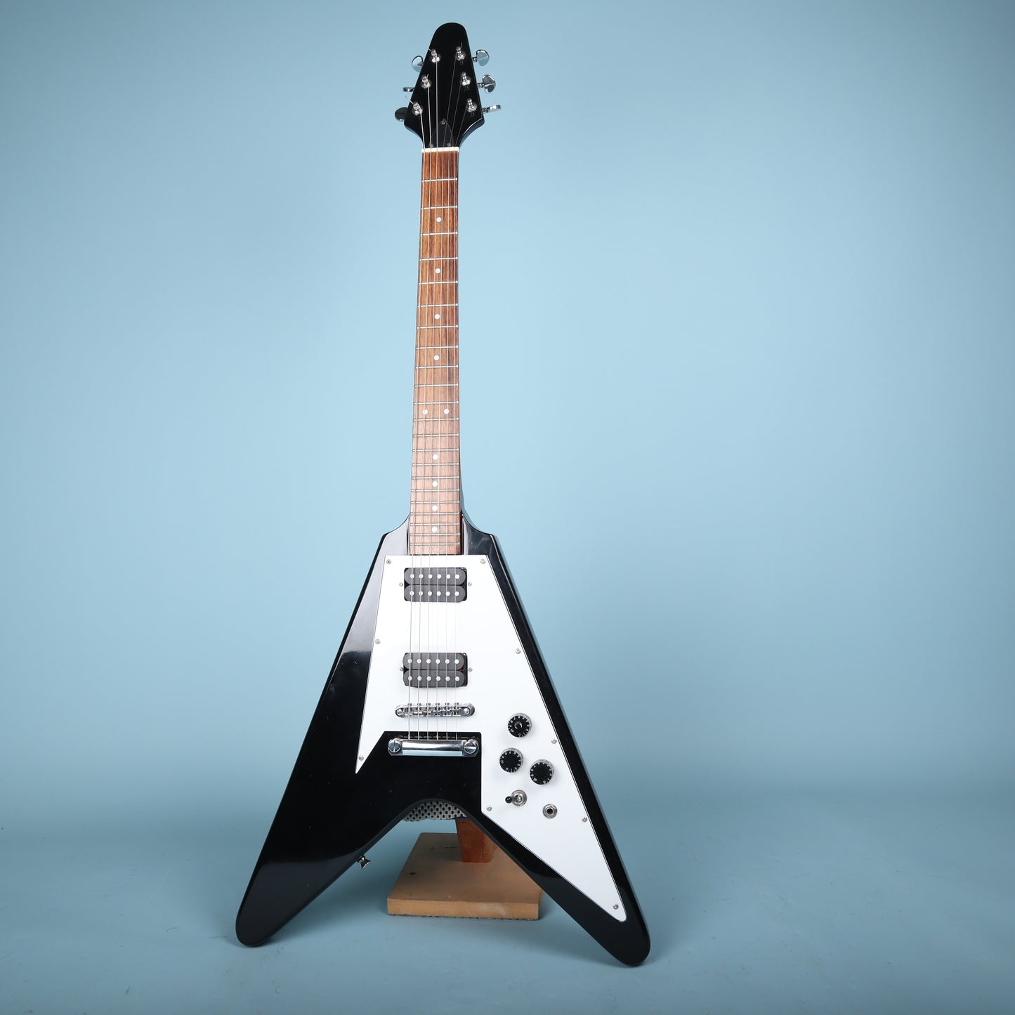 Flying V Style Electric Guitar in Black with White Pickguard