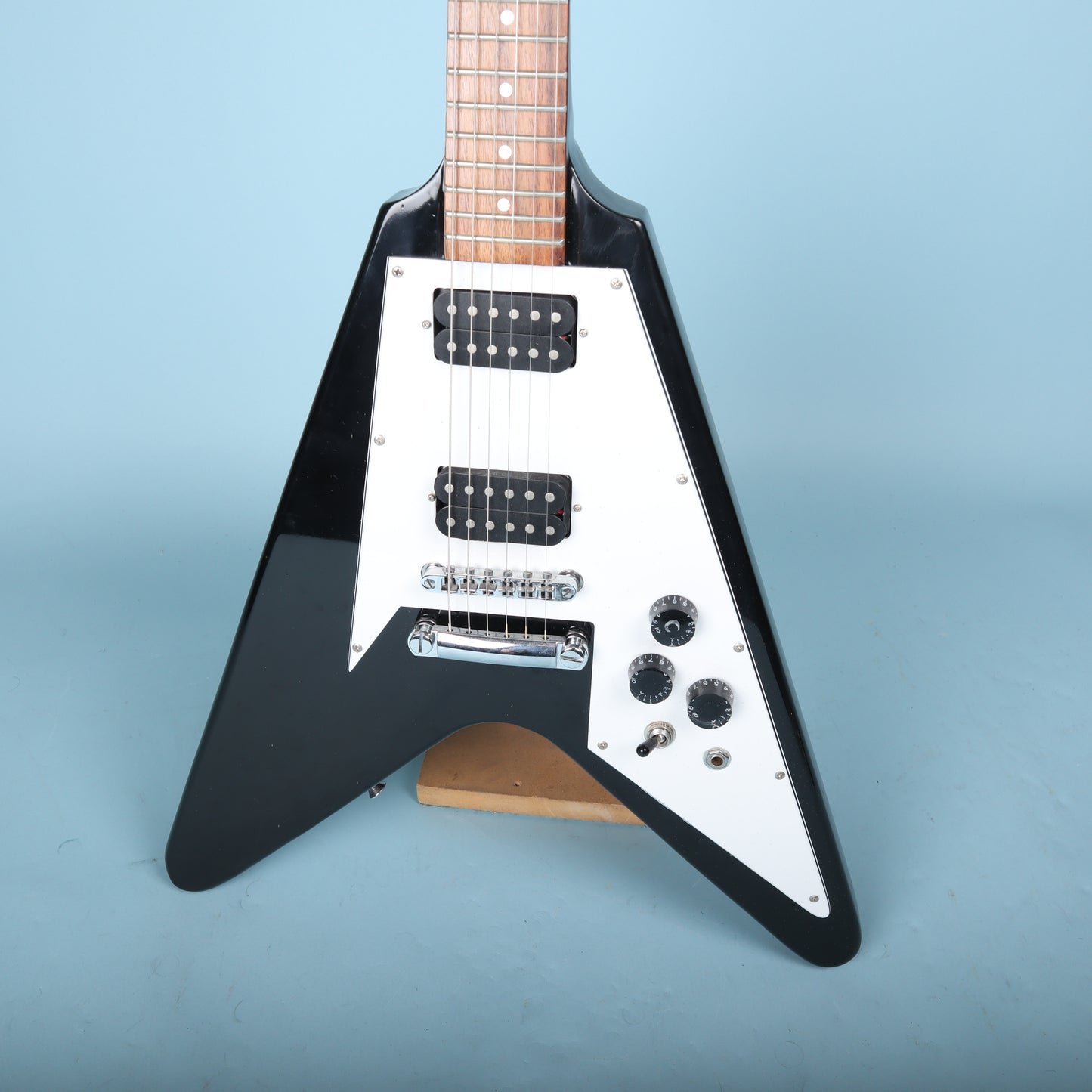 Flying V Style Electric Guitar in Black with White Pickguard