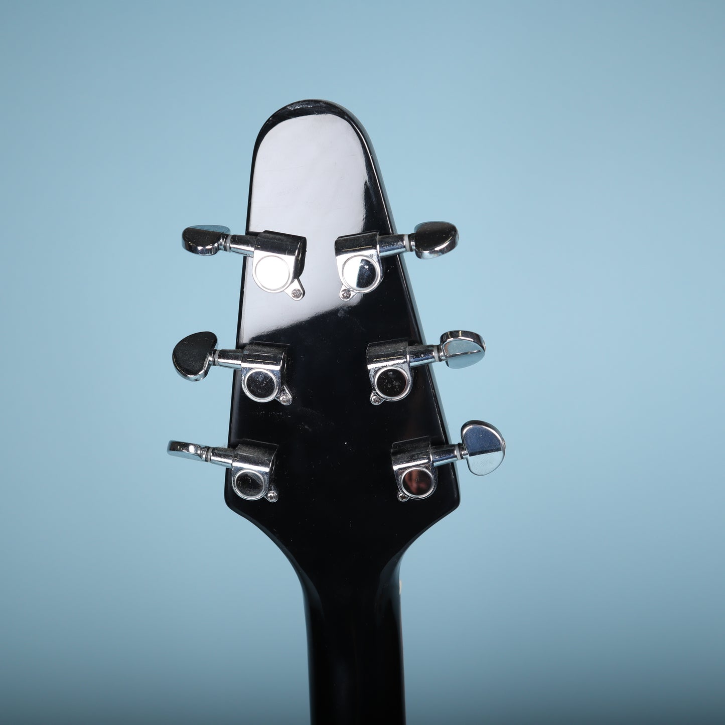 Flying V Style Electric Guitar in Black with White Pickguard