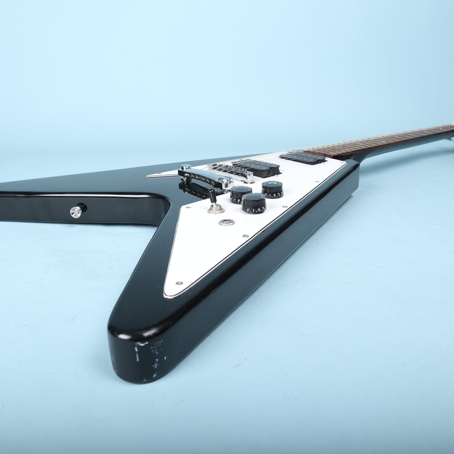 Flying V Style Electric Guitar in Black with White Pickguard