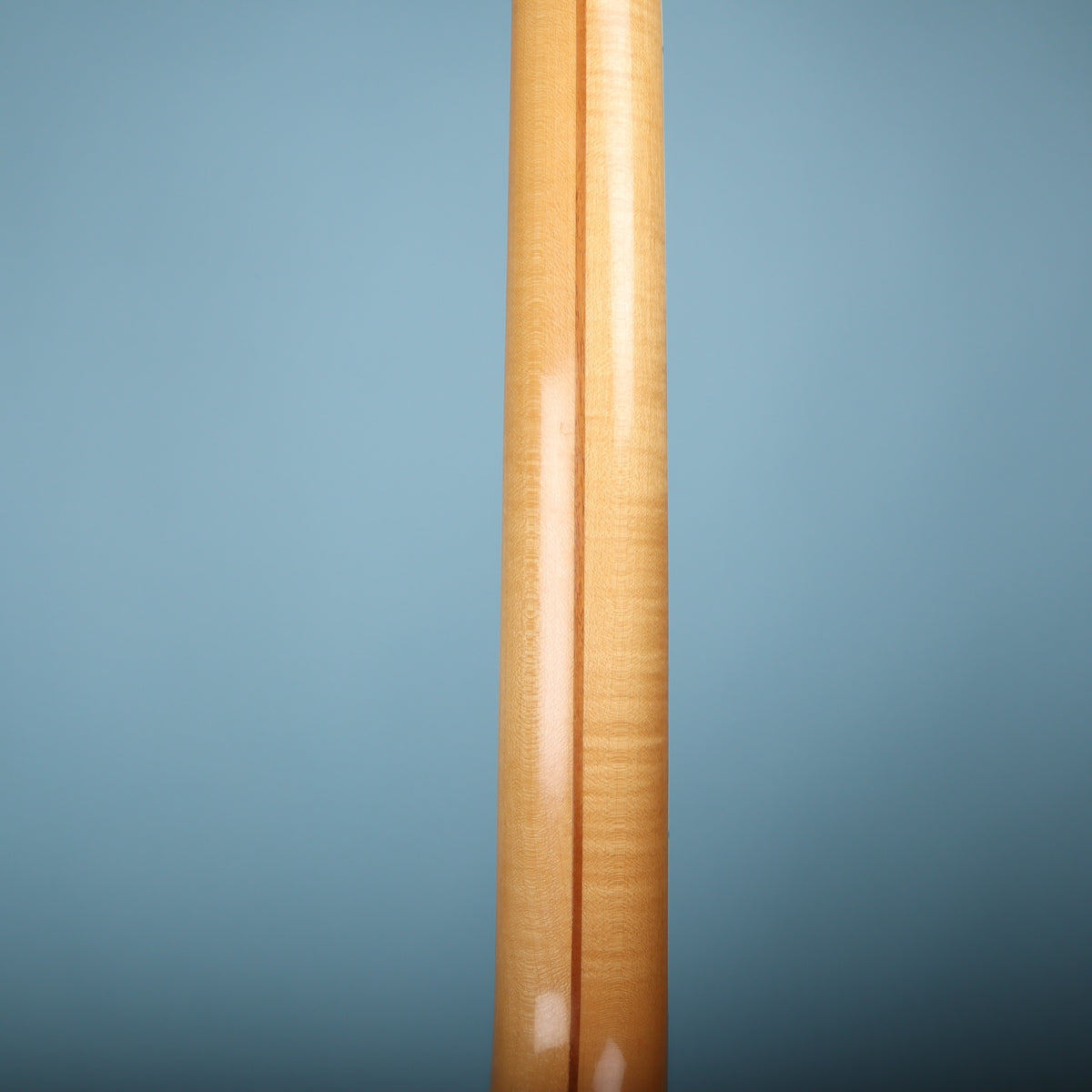 Rear view of flame maple neck showing center stripe construction.