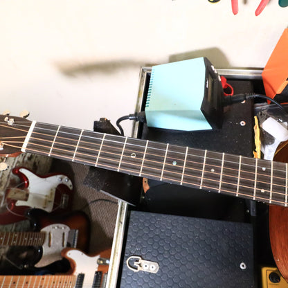 Martin 0-18 neck resting on a workbench neck support block.