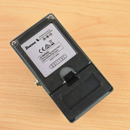Underside view of the Ibanez TS9 showing the manufacturer label, serial number, and battery compartment door.
