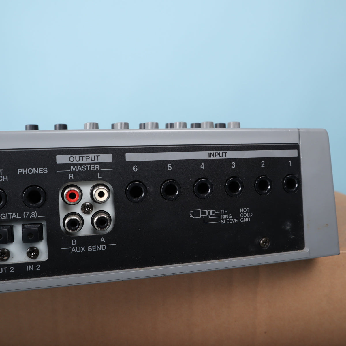 Close-up of Roland VS-880EX rear audio connections including Master RCA outputs, Aux Sends, and 1/4-inch inputs.