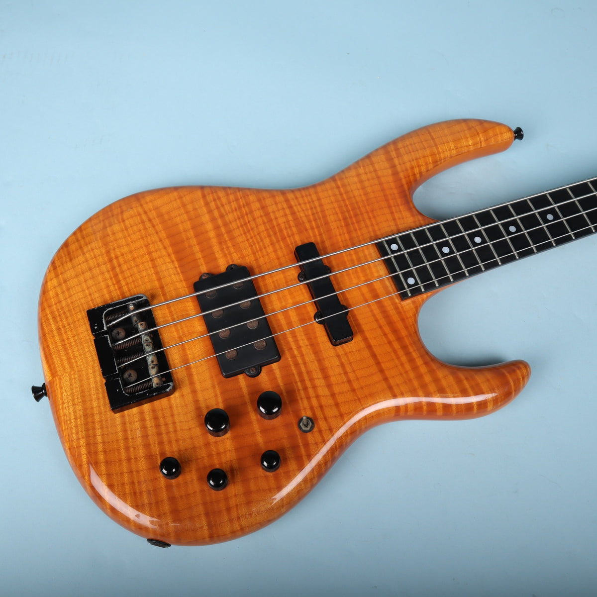 Overhead angled view of the Carvin LB70 carved flame maple body.