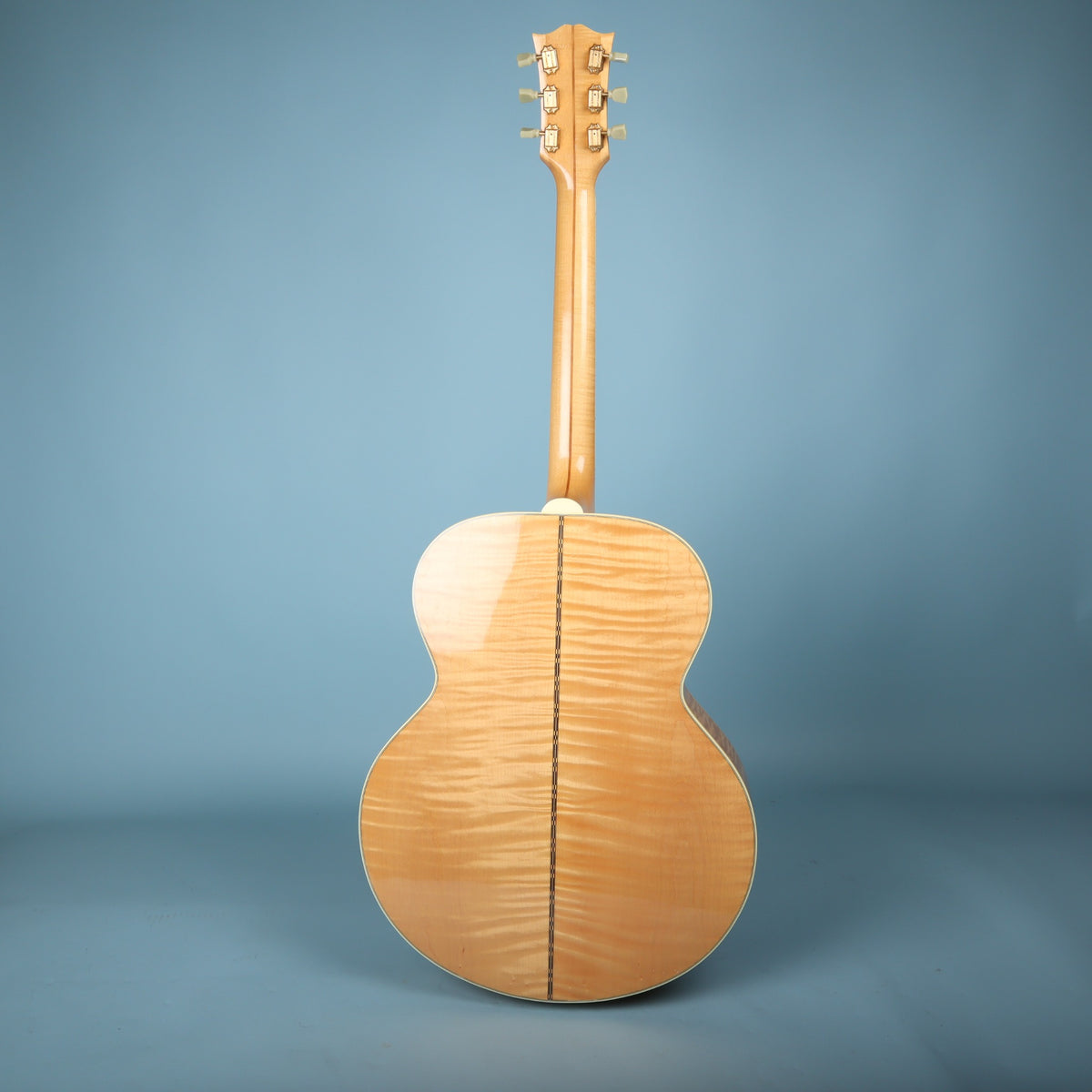 Full rear view of guitar displaying flame maple back and two-piece flame maple neck.