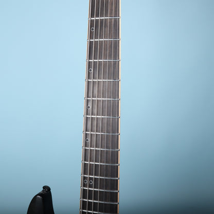 Close-up of the Schecter KM-7 MK-II ebony fretboard with offset ring markers and stainless frets