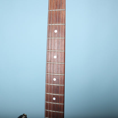 Direct view of rosewood fretboard with dot position inlays and metal frets.