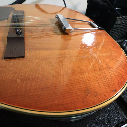 Detailed view of extensive vintage lacquer finish checking on the spruce top of a Gibson B-25-12.