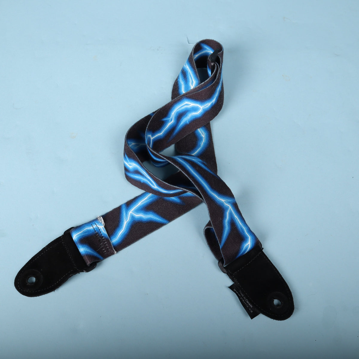 Folded reverse view of the Perri's blue lightning guitar strap