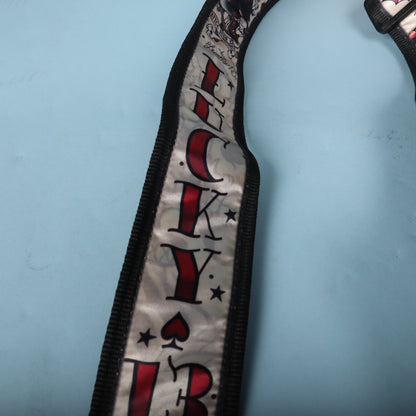 Close-up view of the vertical Lucky 13 text print along the strap ribbon