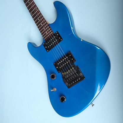 Angled view of the guitar body with pickups and controls