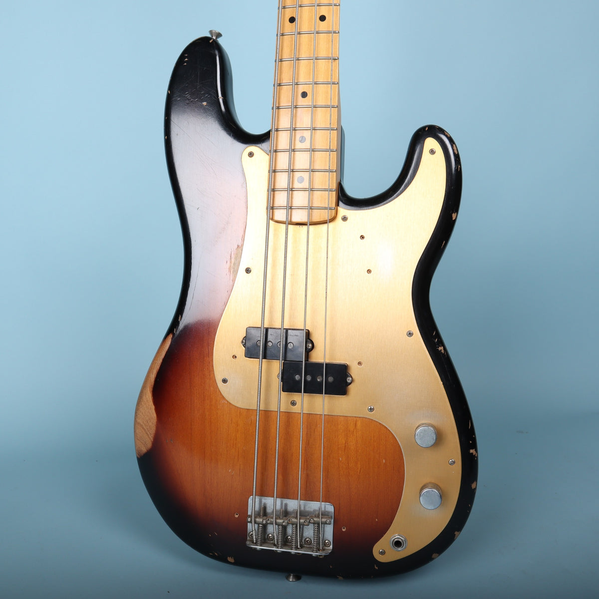 Front body view of the 2009 Fender Road Worn '50s Precision Bass in 2-Color Sunburst with gold anodized pickguard.