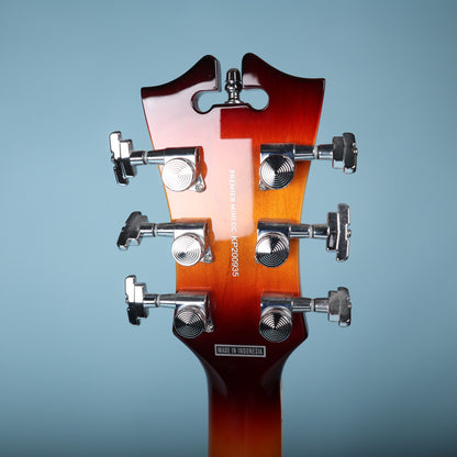 Rear headstock showing tuning keys, model name, serial KP200935, and Indonesia mark.