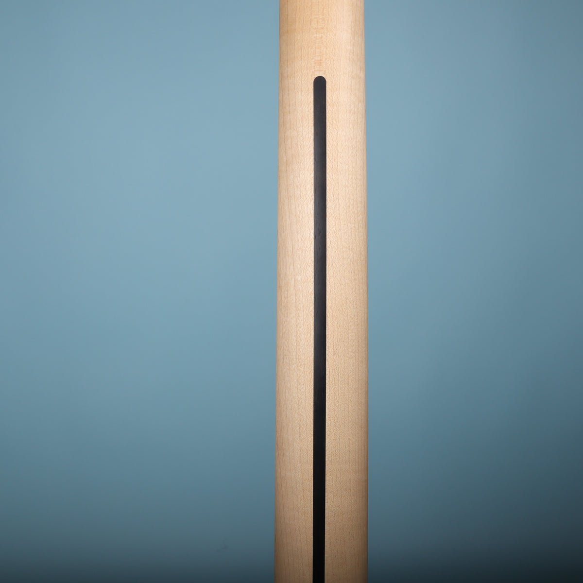 Rear view of maple neck with skunk stripe.