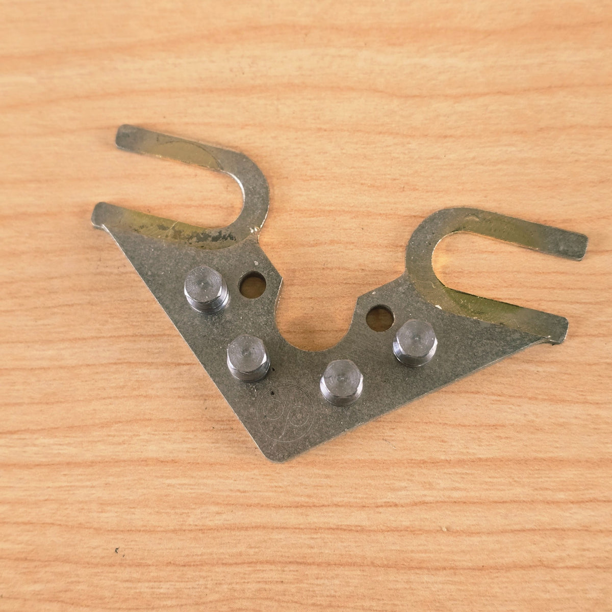 Top view showing roller alignment, open mounting forks, and etched DP logo