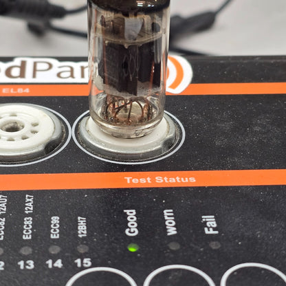 Close-up of tube tester panel with green Good light lit during 12AX7 test.