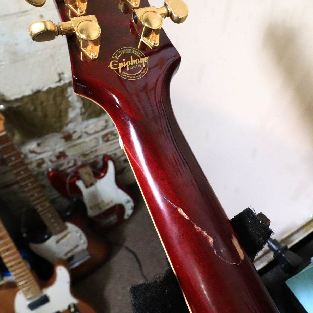 Angled rear headstock view showing Grover tuners