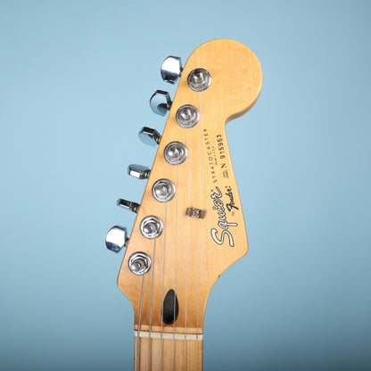 Headstock showing Squier by Fender logo and serial number N 915953