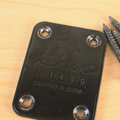 Close-up of Jackson black neck plate showing logo and serial number CWJ1540929