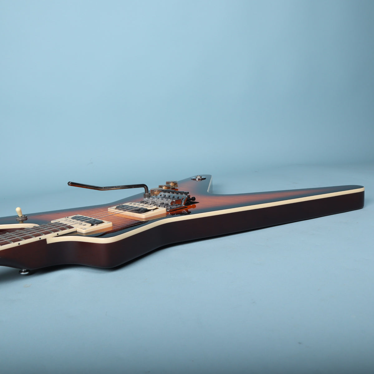 Bass-side profile of Dean ML body showing side binding and volume knobs