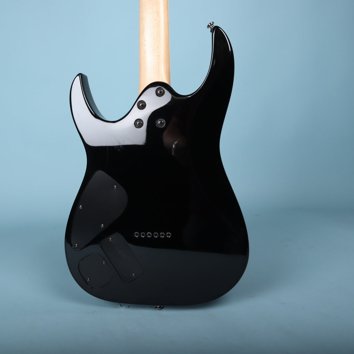 Back view of black Ibanez RGA42 body showing neck joint and cavity covers