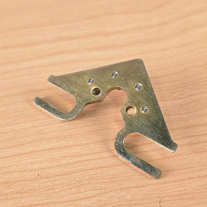 Rear view of String Butler V3 baseplate showing flush-set roller rivets