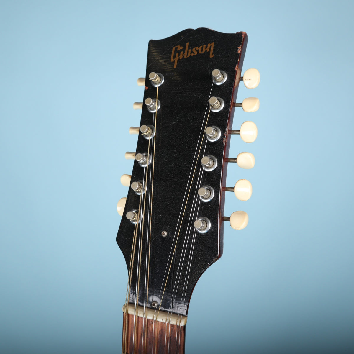 Headstock face of the Gibson B-25-12 showing tuners and logo.
