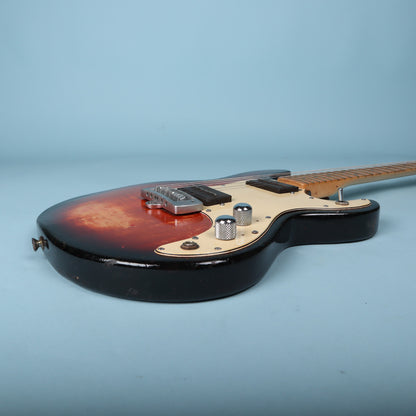 Side view of the lower bout and output jack area of the body.