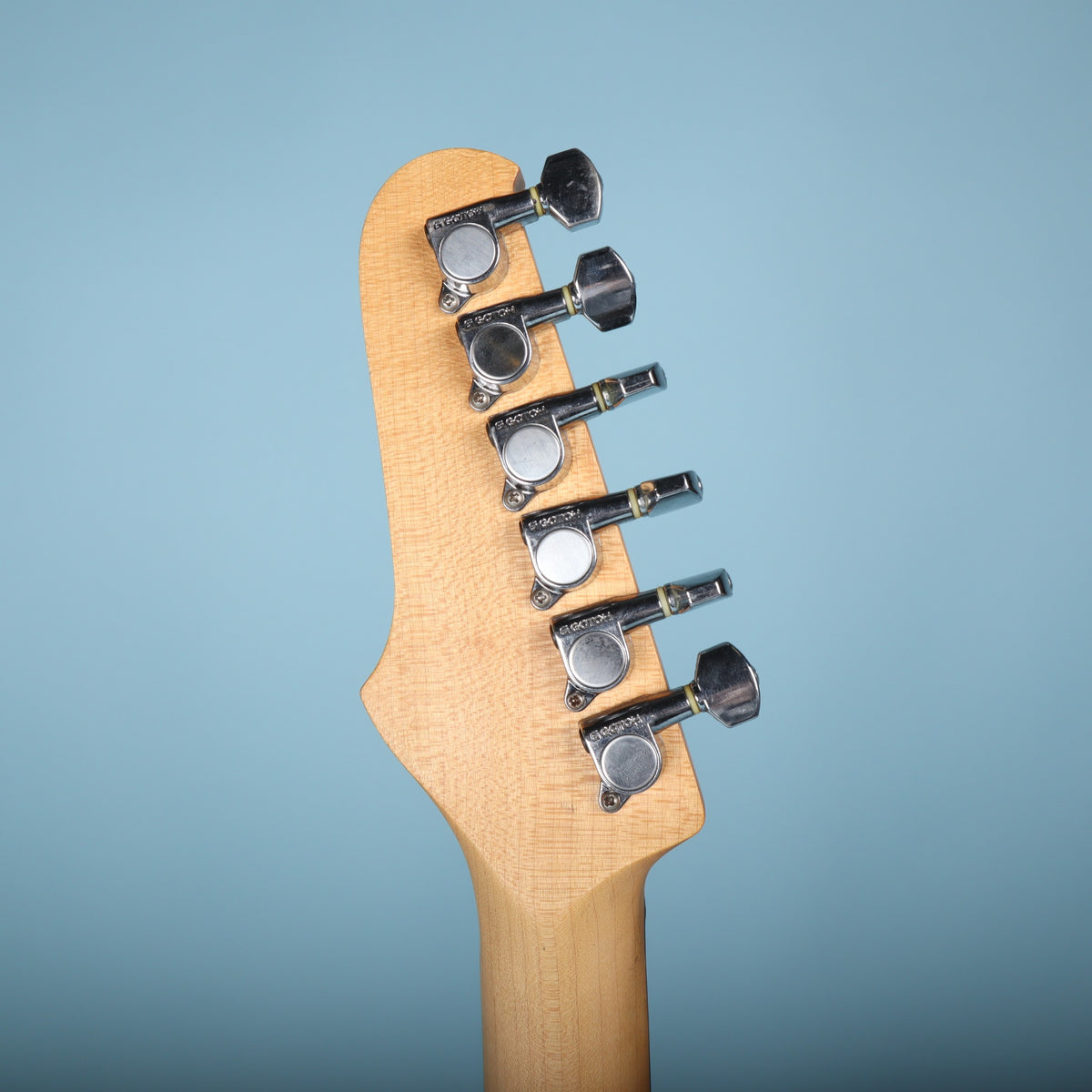 Back of headstock showing six sealed Gotoh tuning machines in a row.