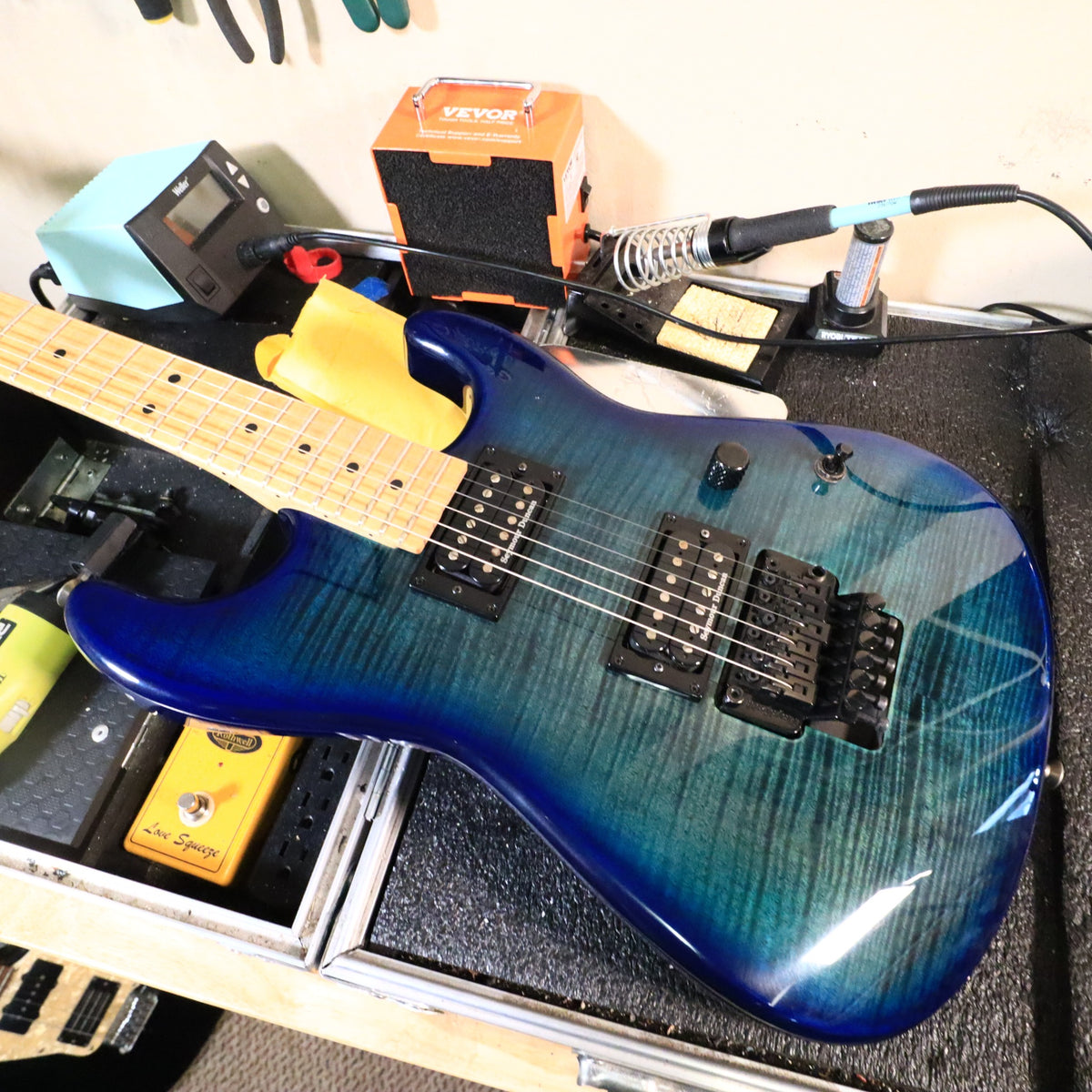 Overhead workbench view of Charvel guitar body