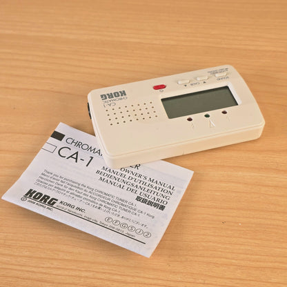 Upper-angled view of the front panel and controls of the Korg CA-1 tuner.