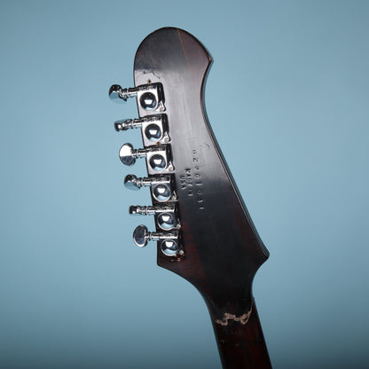 Rear of the headstock showing Grover tuners, stamped serial number 82961031, Made in USA stamp, and repaired fracture line.