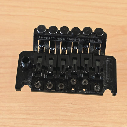 Top perspective showing the arm collar, saddles, and fine-tuner ridge.