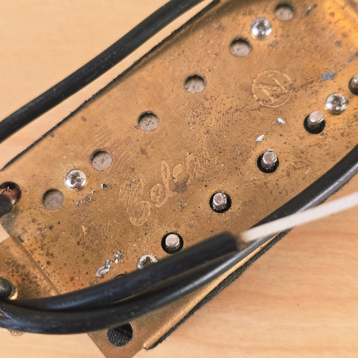 Underside of Jackson pickup showing brass baseplate and stamped Select logo