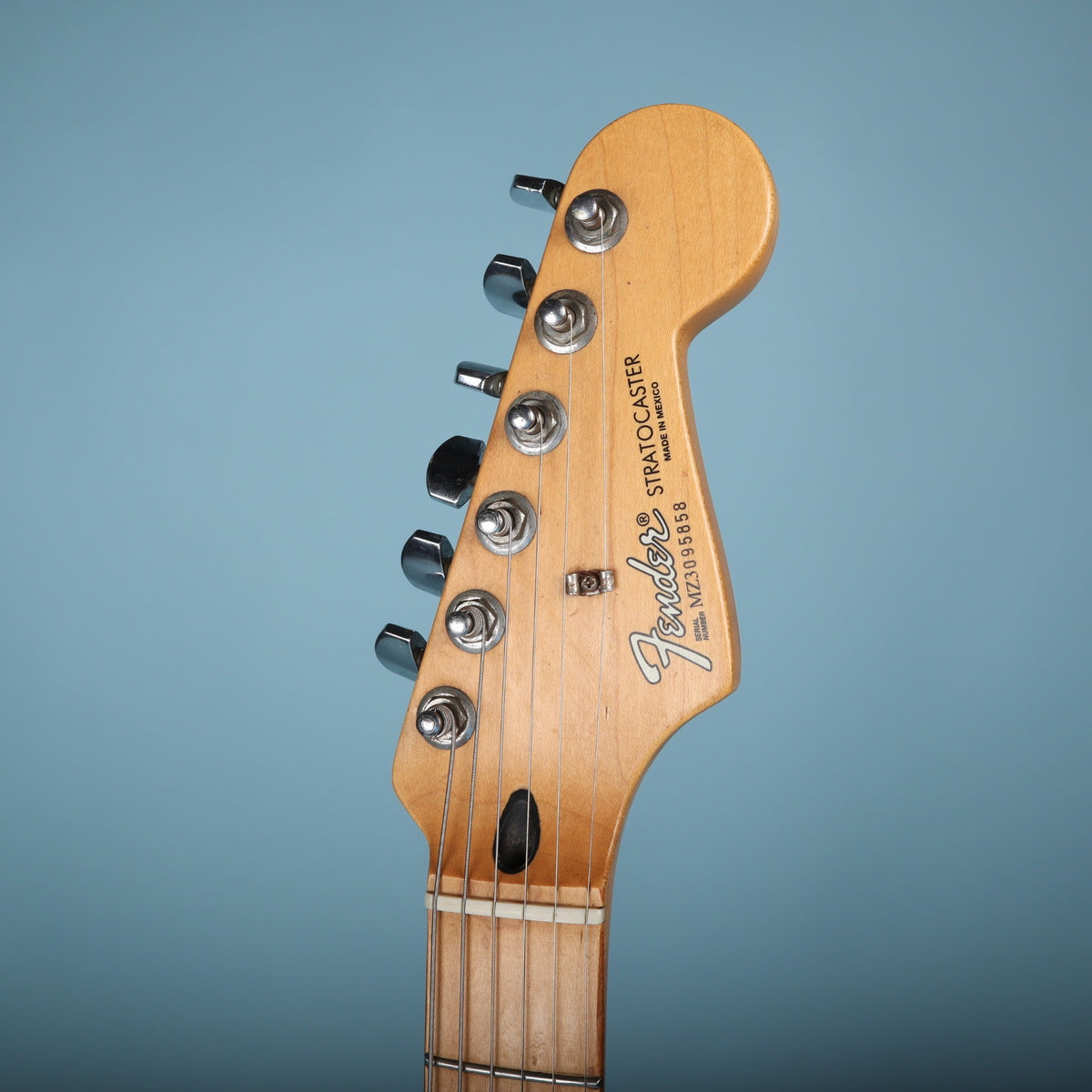 Headstock close-up showing Fender logo and Made in Mexico text