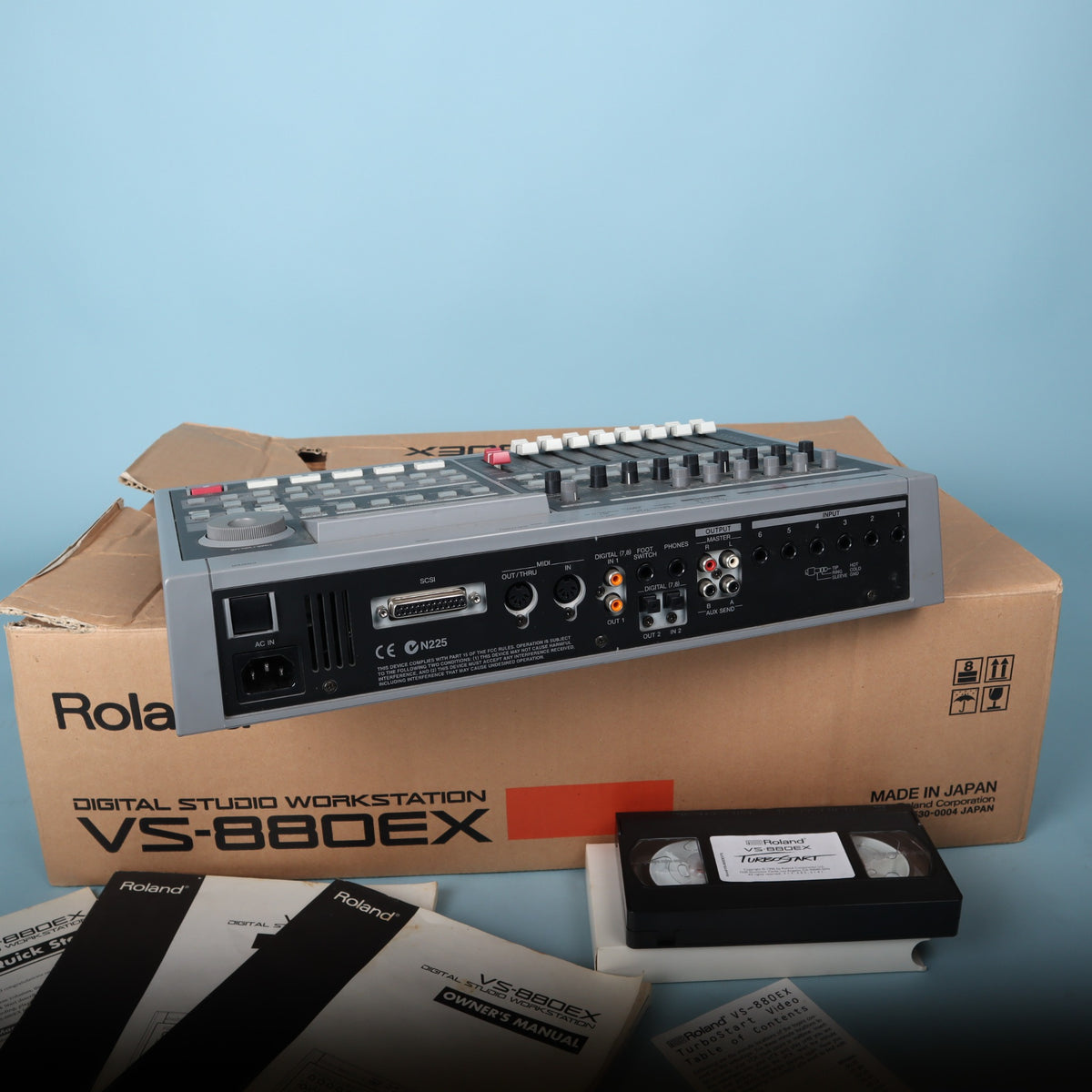 Rear connection panel of Roland VS-880EX featuring audio inputs, outputs, SCSI, and MIDI ports.