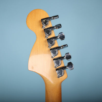 Close-up of back of headstock displaying six Fender Japan tuning machines.