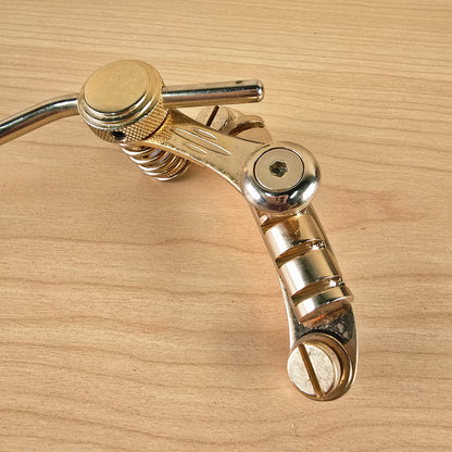 Top-down detail of Duesenberg Les Trem II bridge string-anchor bar and mounting screw slot