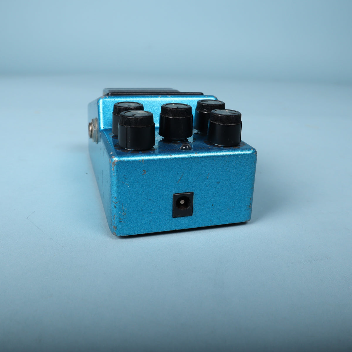 Top edge view showing the DC power jack and upper control knobs