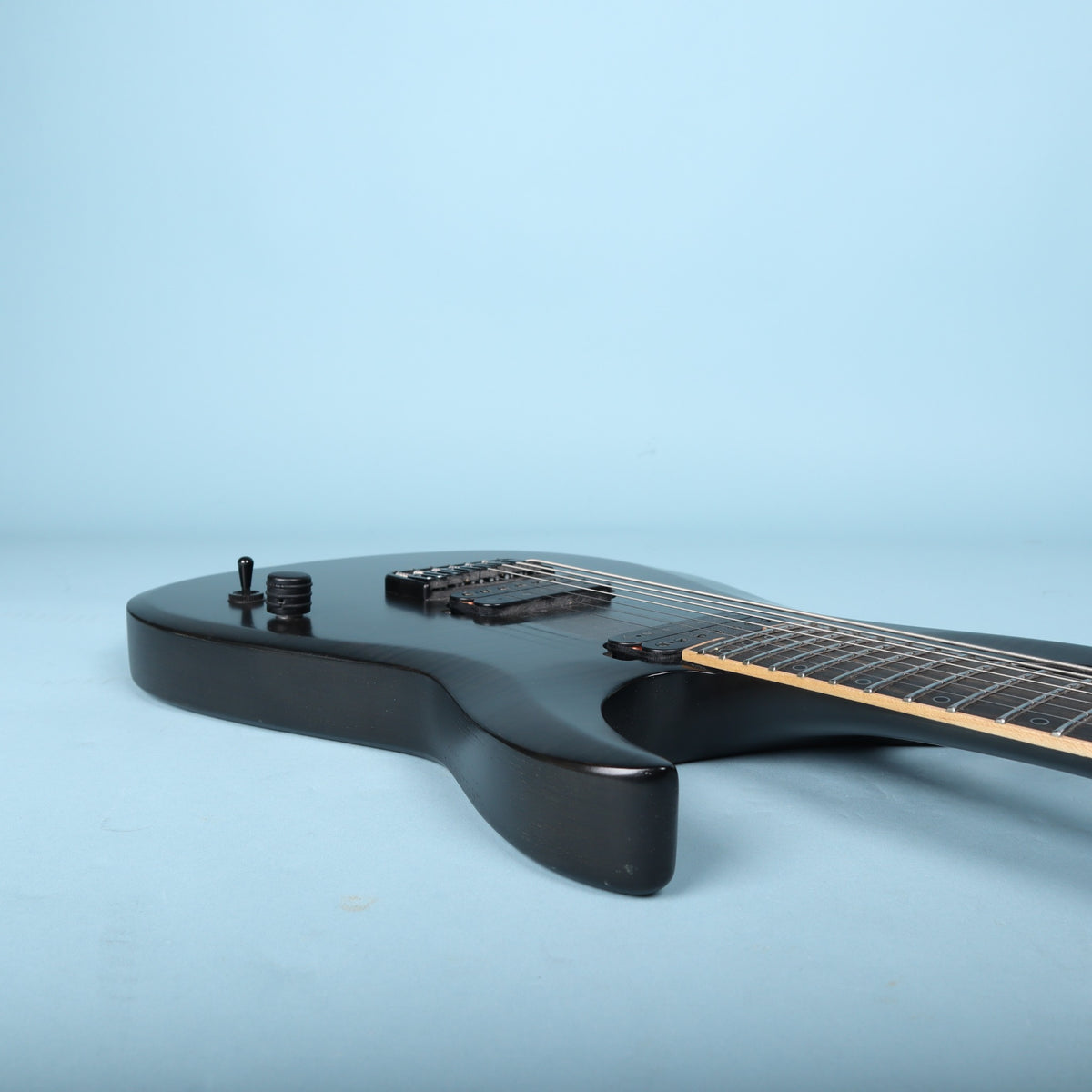 Schecter KM-7 MK-II on a workbench during inspection