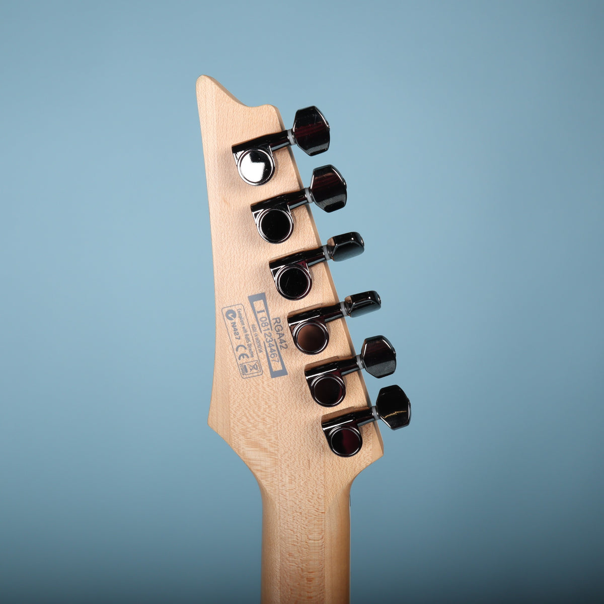 Back of Ibanez headstock showing tuning machines, serial number I081234467, and model RGA42