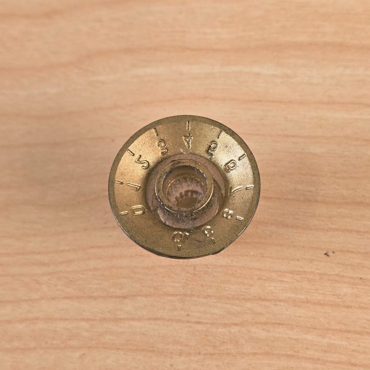 Underside view showing knurled shaft receiver of control knob
