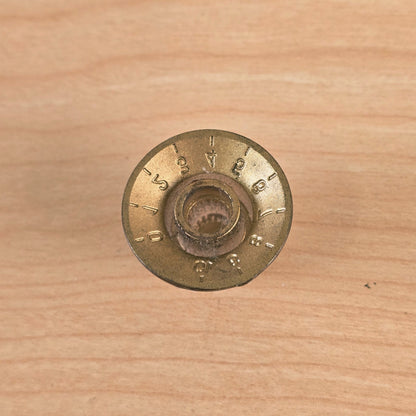 Underside view showing knurled shaft receiver of control knob