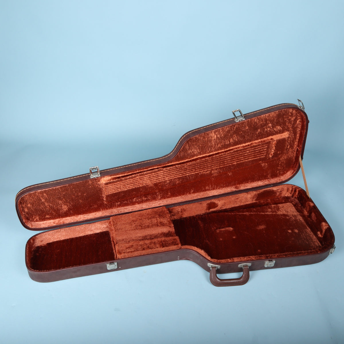 Open Ibanez AH-10 hardshell case showing the plush reddish-orange interior and accessory pocket.